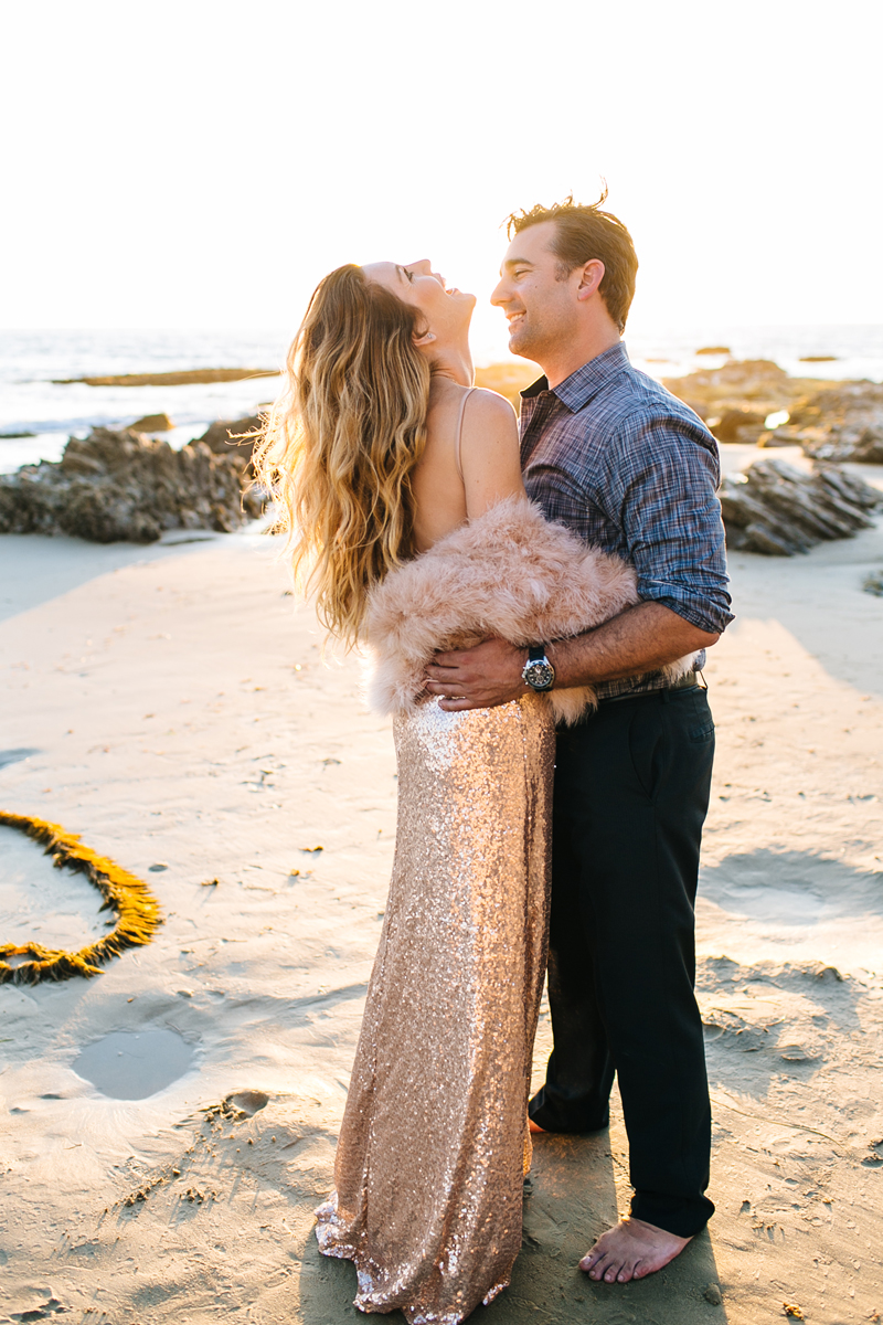 Bride to be in Vintage sequins dress on the beach for Engagement Photos