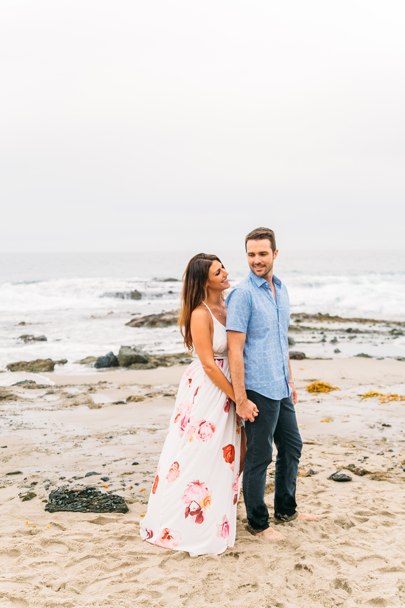 Romantic Engagement Photos on Victoria Beach with a castle