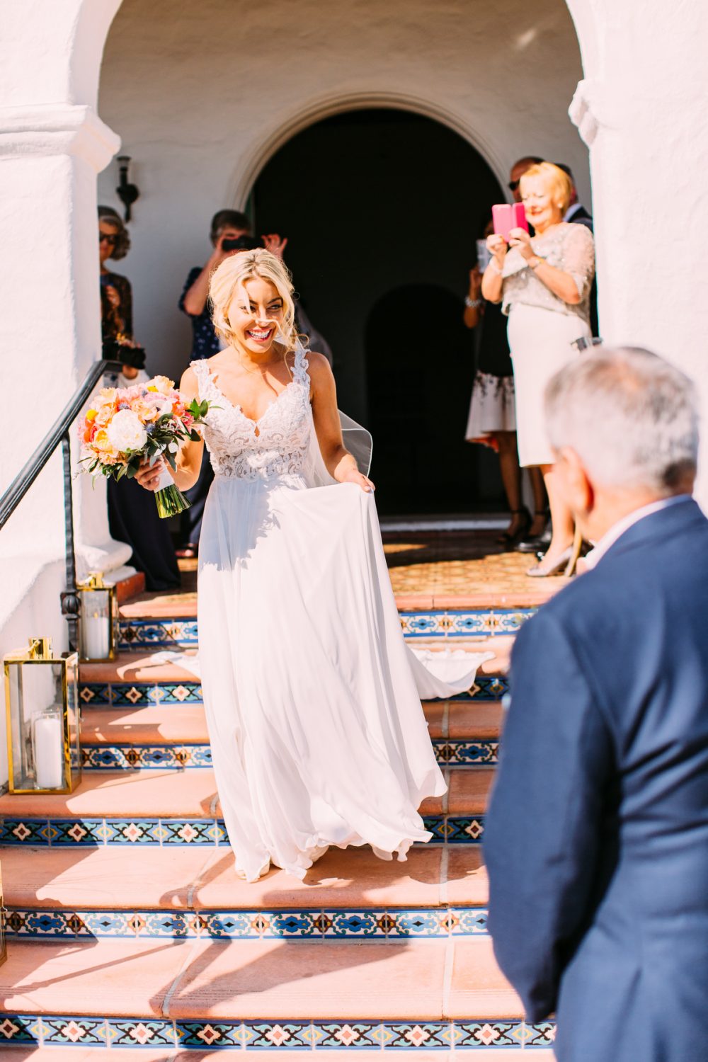 bride meeting her dad to walk her down the aisle at Casa Romantica
